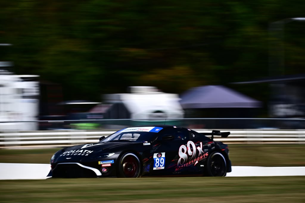 Black number 89 GT race car at speed