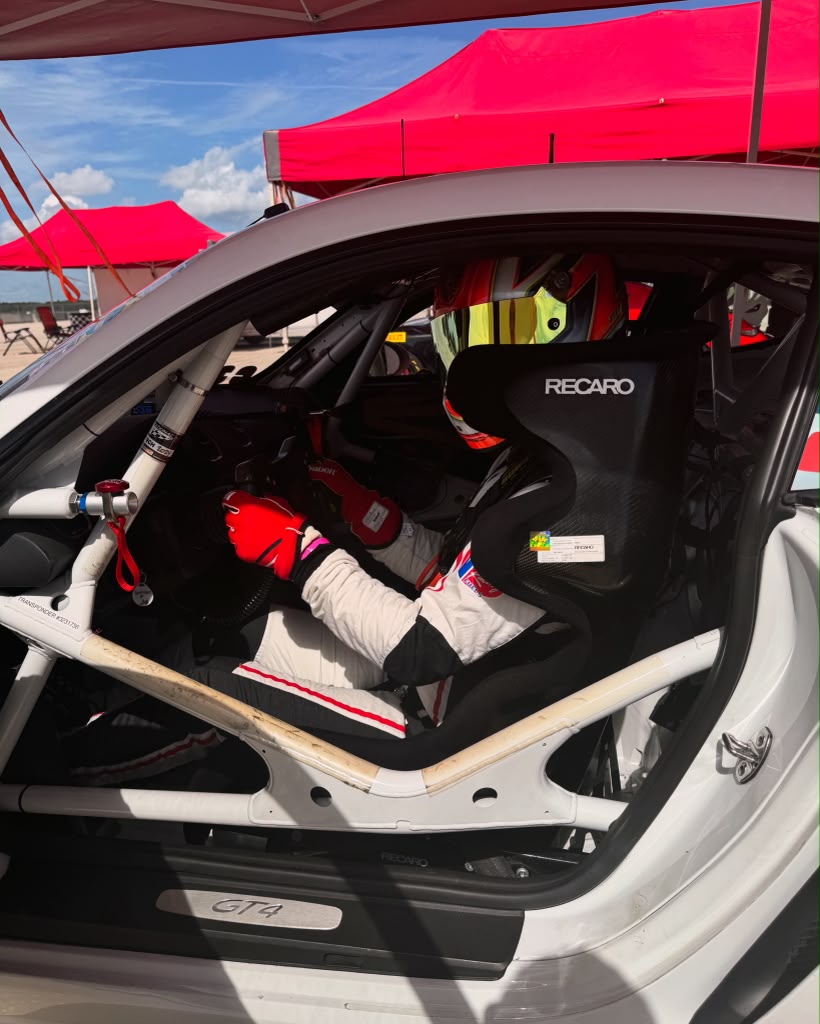 Eric Zitza seated in a race car cockpit